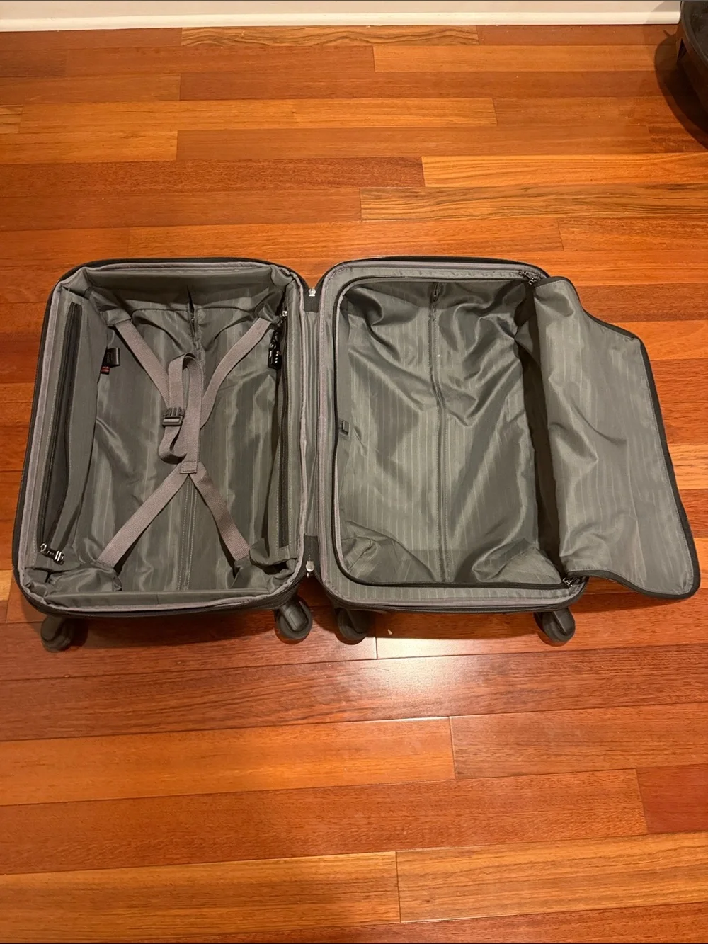 Tumi Black Carry-On Spinner with Front Zip Pocket